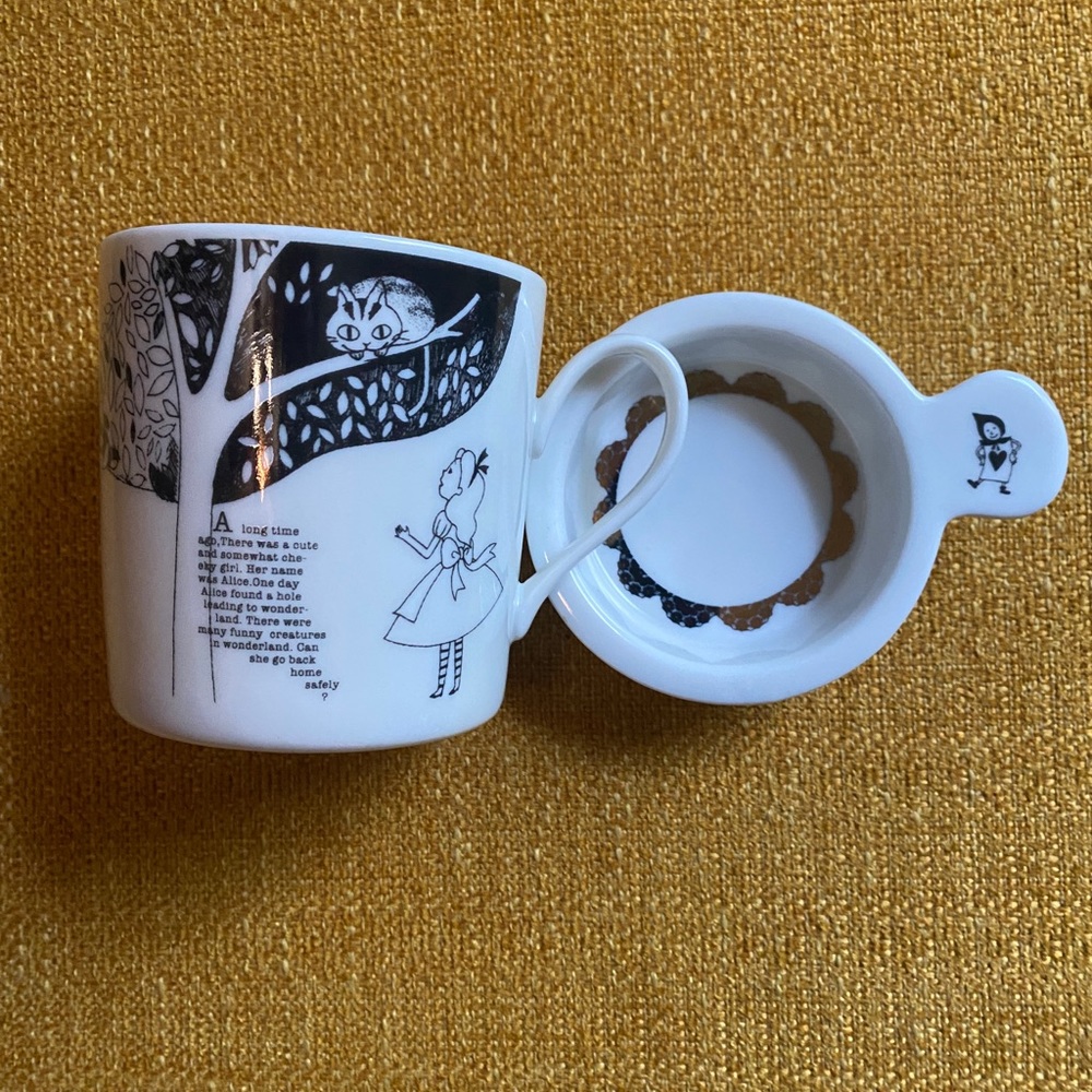 Alice in Wonderland tea mug with lid.